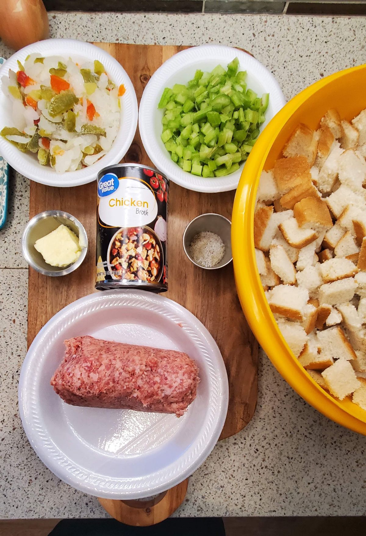 The ingredients for a meatloaf on a cutting board.
