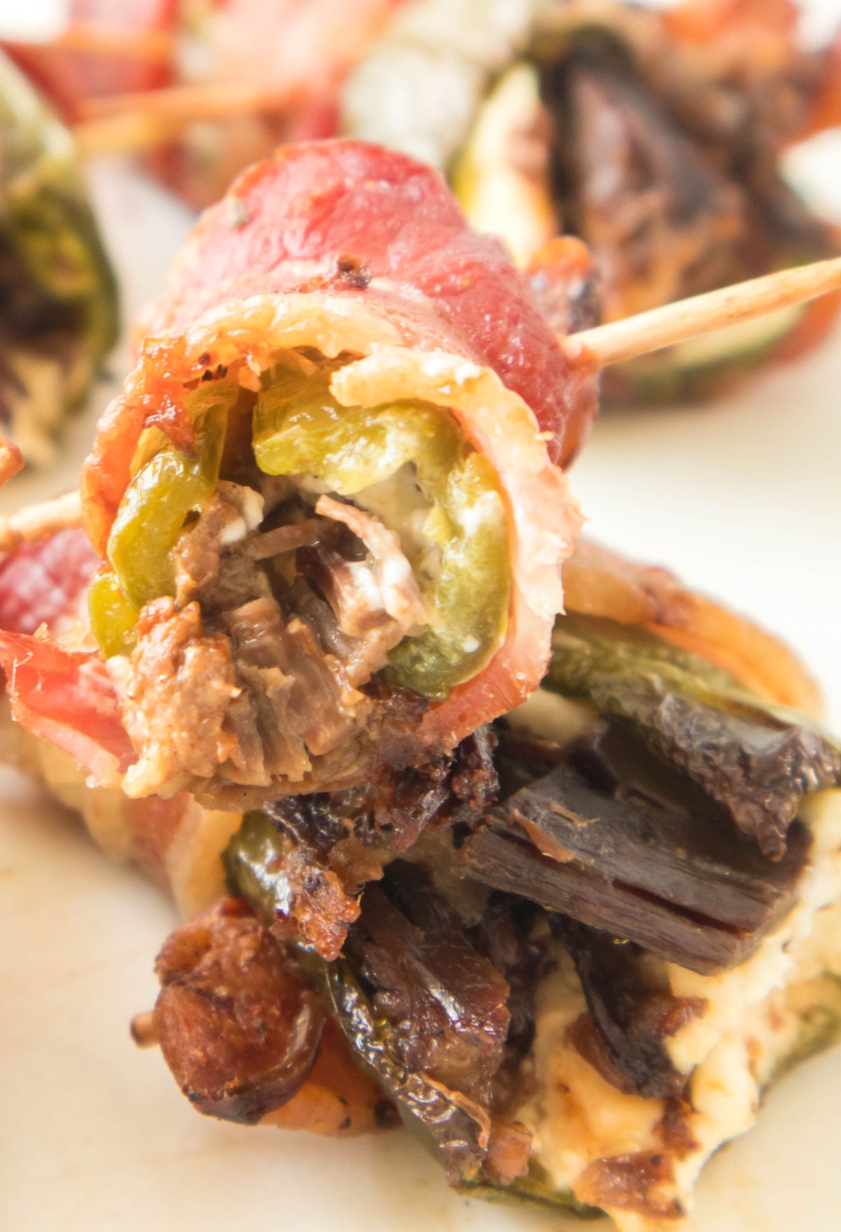 Stuffed peppers with bacon and cheese on skewers.